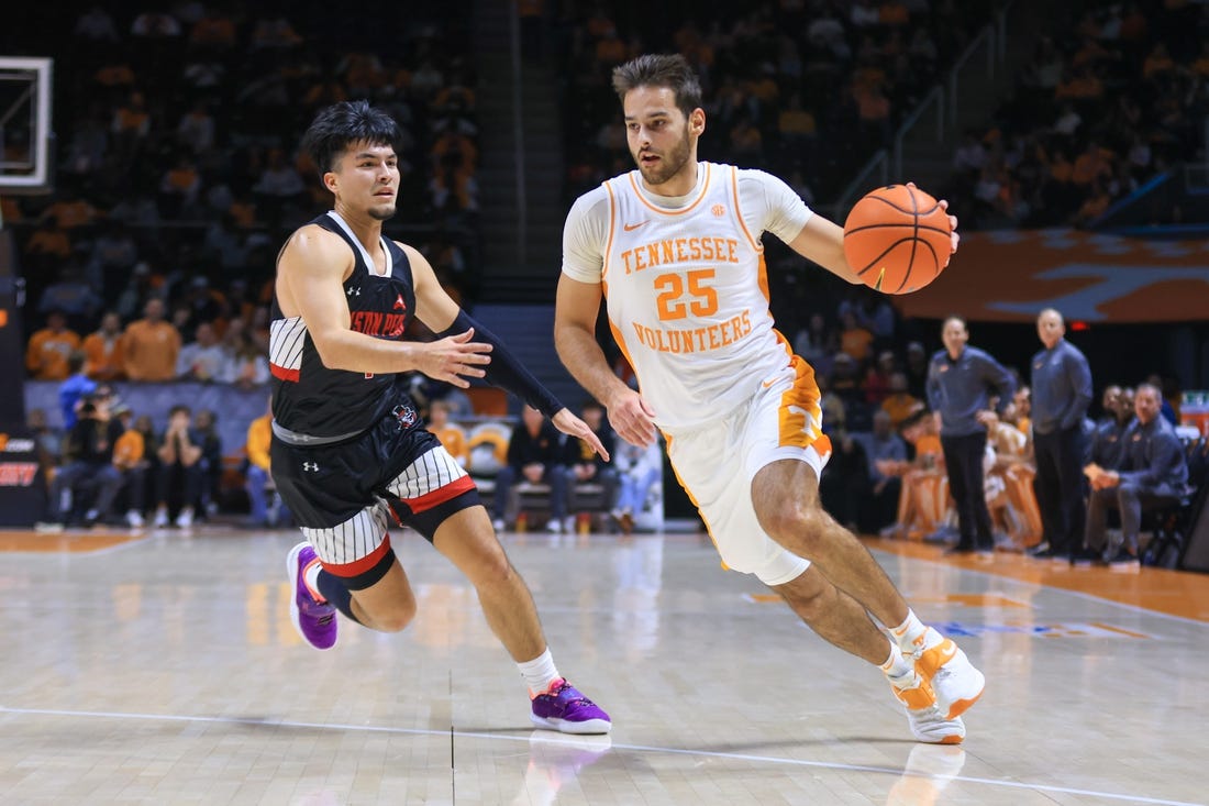 Dec 21, 2022; Knoxville, Tennessee, USA; Tennessee Volunteers guard Santiago Vescovi (25) moves the ball against Austin Peay Governors guard Carlos Paez (1) at Thompson-Boling Arena. Mandatory Credit: Randy Sartin-USA TODAY Sports