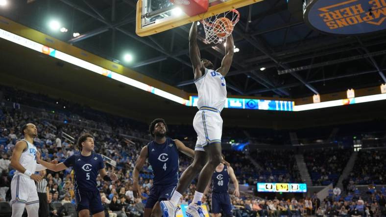 Dec 21, 2022; Los Angeles, California, USA; UCLA Bruins forward Adem Bona (3) dunks the ball against the UC Davis Aggies in the second half at Pauley Pavilion presented by Wescom. UCLA defeated UC Davis 81-54. Mandatory Credit: Kirby Lee-USA TODAY Sports