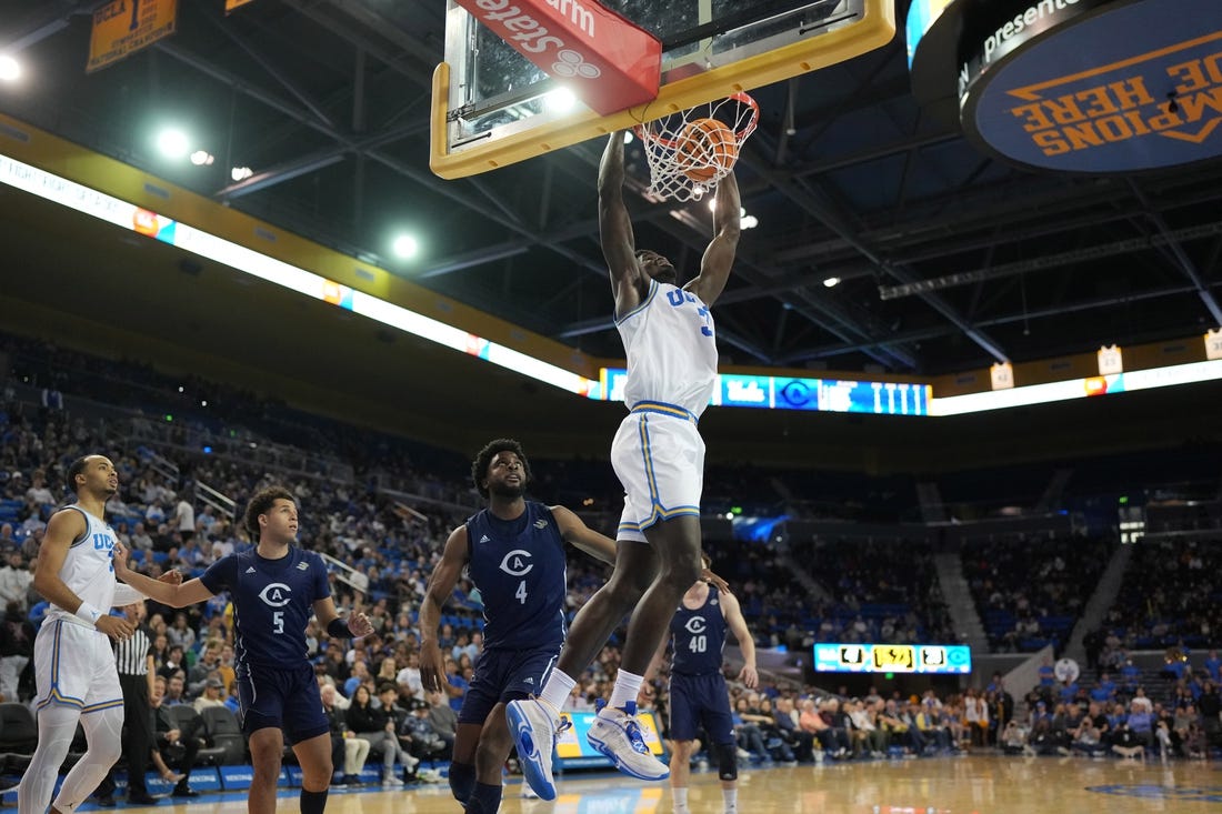 Dec 21, 2022; Los Angeles, California, USA; UCLA Bruins forward Adem Bona (3) dunks the ball against the UC Davis Aggies in the second half at Pauley Pavilion presented by Wescom. UCLA defeated UC Davis 81-54. Mandatory Credit: Kirby Lee-USA TODAY Sports