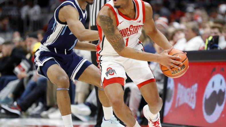 Dec 21, 2022; Columbus, Ohio, USA; Ohio State Buckeyes guard Roddy Gayle Jr. (1) is defended by Maine Black Bears guard Kellen Tynes (1) during the first half at Value City Arena. Mandatory Credit: Joseph Maiorana-USA TODAY Sports