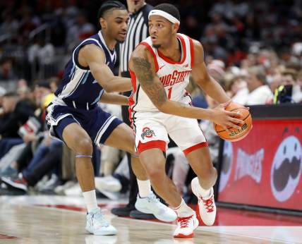 Dec 21, 2022; Columbus, Ohio, USA; Ohio State Buckeyes guard Roddy Gayle Jr. (1) is defended by Maine Black Bears guard Kellen Tynes (1) during the first half at Value City Arena. Mandatory Credit: Joseph Maiorana-USA TODAY Sports