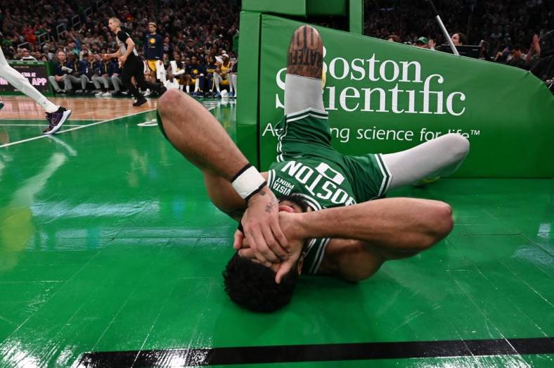 Dec 21, 2022; Boston, Massachusetts, USA; Boston Celtics forward Jayson Tatum (0) reacts after being fouled during the fourth quarter of a game against the Indiana Pacers at the TD Garden. Mandatory Credit: Brian Fluharty-USA TODAY Sports