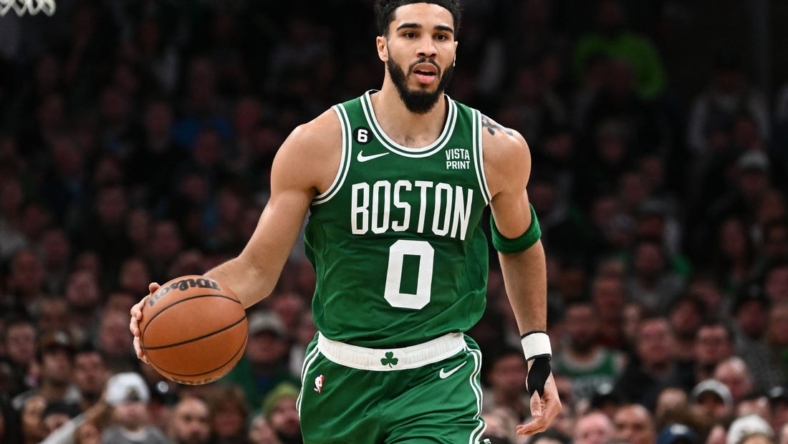 Dec 21, 2022; Boston, Massachusetts, USA; Boston Celtics forward Jayson Tatum (0) dribbles the ball against the Indiana Pacers during the third quarter at the TD Garden. Mandatory Credit: Brian Fluharty-USA TODAY Sports