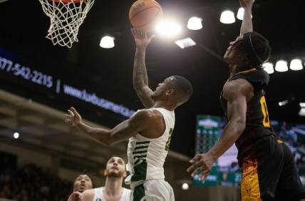 Dec 21, 2022; San Francisco, California, USA; San Francisco Dons guard Khalil Shabazz (left) is fouled by Arizona State Sun Devils guard DJ Horne (0) as he drives to the basket during the first half at War Memorial at the Sobrato Center. Mandatory Credit: D. Ross Cameron-USA TODAY Sports