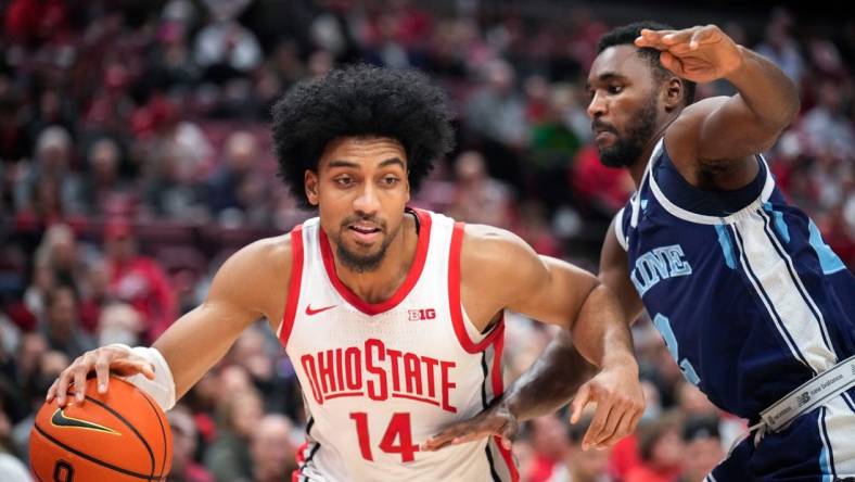 Dec 21, 2022; Columbus, Ohio, United States; Ohio State Buckeyes forward Justice Sueing (14) is defended by Maine Black Bears guard Ja'Shonte Wright-McLeish (2) during the first half of the NCAA division I basketball game at Value City Arena on Wednesday night. Mandatory Credit: Joseph Scheller-The Columbus Dispatch

Basketball Ceb Mbk Maine Maine At Ohio State