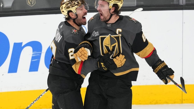 Dec 21, 2022; Las Vegas, Nevada, USA; Vegas Golden Knights right wing Mark Stone (61) celebrates with Vegas Golden Knights center Chandler Stephenson (20) after scoring a goal against the Arizona Coyotes during the third period at T-Mobile Arena. Mandatory Credit: Stephen R. Sylvanie-USA TODAY Sports