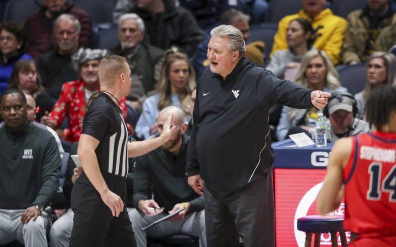Dec 22, 2022; Morgantown, West Virginia, USA; West Virginia Mountaineers head coach Bob Huggins argues a call with an official during the first half against the Stony Brook Seawolves at WVU Coliseum. Mandatory Credit: Ben Queen-USA TODAY Sports