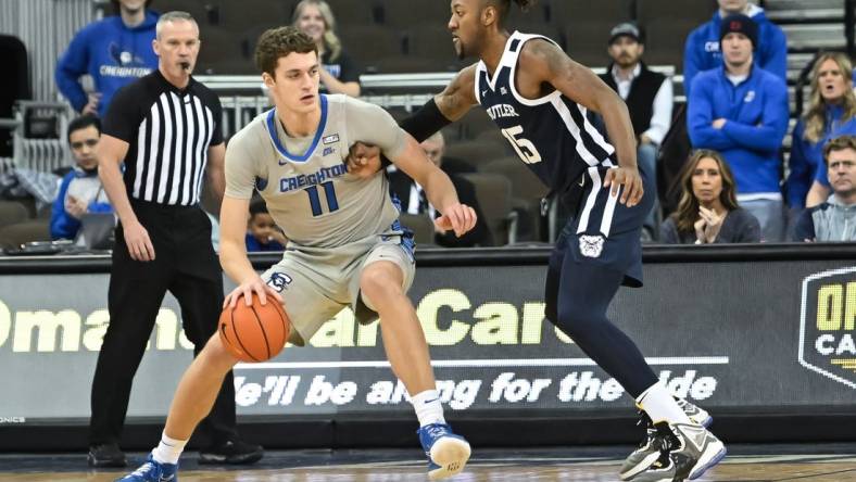 Dec 22, 2022; Omaha, Nebraska, USA; Creighton Bluejays center Ryan Kalkbrenner (11) backs in on Butler Bulldogs center Manny Bates (15) in the first half at CHI Health Center Omaha. Mandatory Credit: Steven Branscombe-USA TODAY Sports