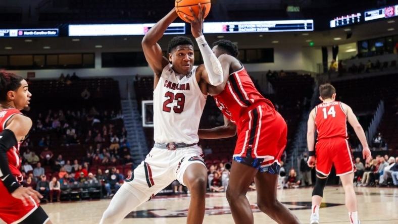 Dec 22, 2022; Columbia, South Carolina, USA; South Carolina Gamecocks forward Gregory Jackson II (23) drives against the Western Kentucky Hilltoppers in the second half at Colonial Life Arena. Mandatory Credit: Jeff Blake-USA TODAY Sports