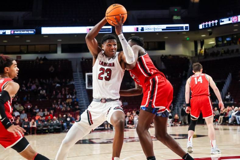 Dec 22, 2022; Columbia, South Carolina, USA; South Carolina Gamecocks forward Gregory Jackson II (23) drives against the Western Kentucky Hilltoppers in the second half at Colonial Life Arena. Mandatory Credit: Jeff Blake-USA TODAY Sports