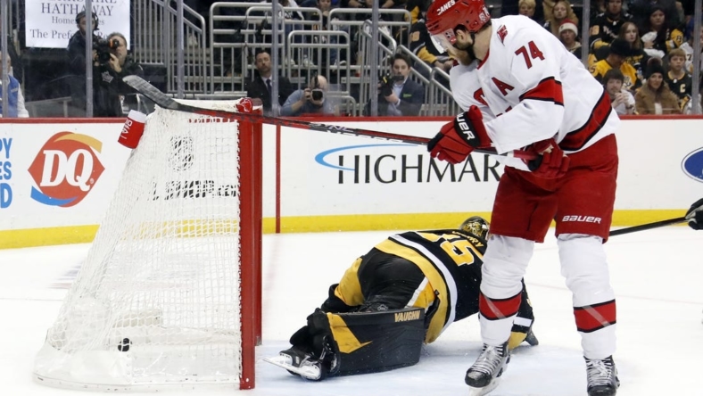Dec 22, 2022; Pittsburgh, Pennsylvania, USA;  Carolina Hurricanes defenseman Jaccob Slavin (74) scores the game winning goal in overtime against the Pittsburgh Penguins at PPG Paints Arena. Carolina won 4-3 in overtime. Mandatory Credit: Charles LeClaire-USA TODAY Sports