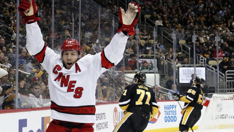 Dec 22, 2022; Pittsburgh, Pennsylvania, USA;  Carolina Hurricanes defenseman Jaccob Slavin (74) reacts after scoring the game winning goal in overtime against the Pittsburgh Penguins at PPG Paints Arena. Carolina won 4-3 in overtime. Mandatory Credit: Charles LeClaire-USA TODAY Sports