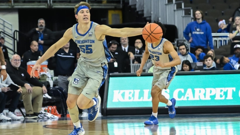 Dec 22, 2022; Omaha, Nebraska, USA;  Creighton Bluejays guard Baylor Scheierman (55) reaches for a loose ball against the Butler Bulldogs in the second half at CHI Health Center Omaha. Mandatory Credit: Steven Branscombe-USA TODAY Sports