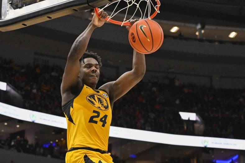 Dec 22, 2022; St. Louis, Missouri, USA;  Missouri Tigers guard Kobe Brown (24) dunks against the Illinois Fighting Illini during the first half at Enterprise Center. Mandatory Credit: Jeff Curry-USA TODAY Sports