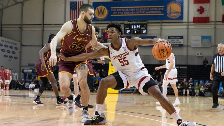 Dec 22, 2022; Santa Cruz, California, USA;  Stanford Cardinal forward Harrison Ingram (55) controls the ball during the first half against Loyola Ramblers center Bryce Golden (35) at Kaiser Permanente Arena. Mandatory Credit: Stan Szeto-USA TODAY Sports