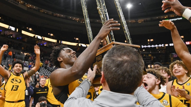 Dec 22, 2022; St. Louis, Missouri, USA;  Missouri Tigers guard Kobe Brown (24) reacts as he sees the Braggin Rights Trophy after the Tigers defeated the Illinois Fighting Illini at Enterprise Center. Mandatory Credit: Jeff Curry-USA TODAY Sports