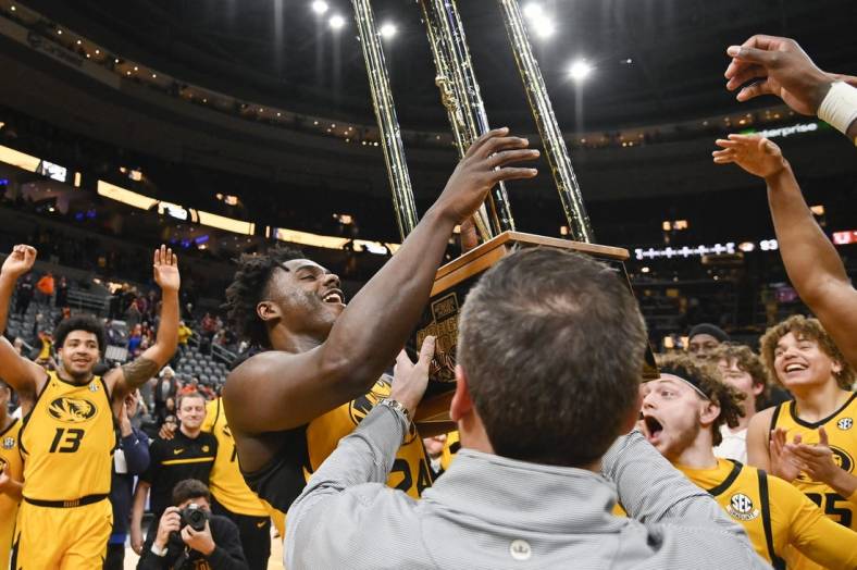 Dec 22, 2022; St. Louis, Missouri, USA;  Missouri Tigers guard Kobe Brown (24) reacts as he sees the Braggin Rights Trophy after the Tigers defeated the Illinois Fighting Illini at Enterprise Center. Mandatory Credit: Jeff Curry-USA TODAY Sports