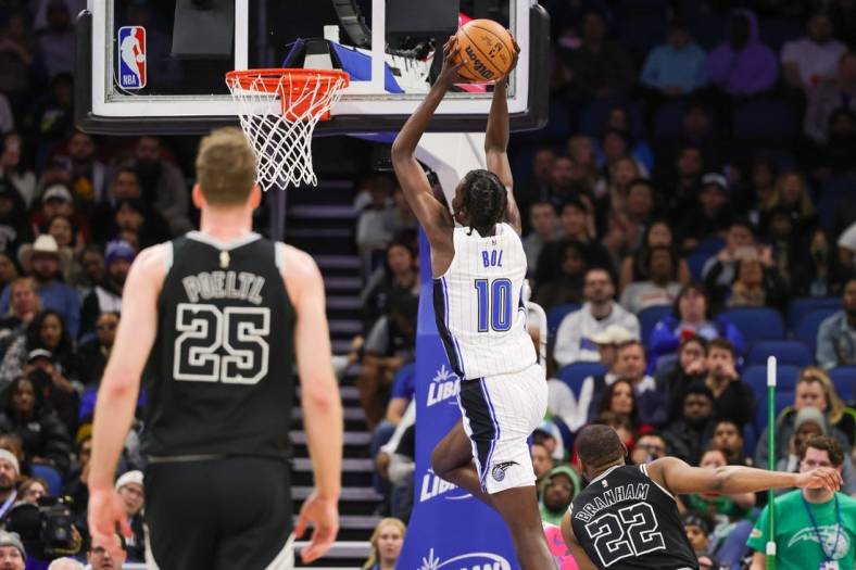 Dec 23, 2022; Orlando, Florida, USA; Orlando Magic center Bol Bol (10) goes to the basket during the second quarter against the San Antonio Spurs at Amway Center. Mandatory Credit: Mike Watters-USA TODAY Sports