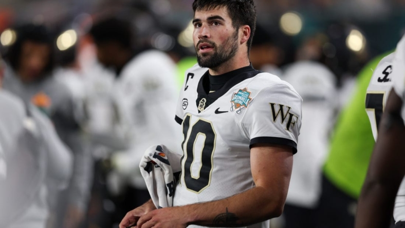 Dec 23, 2022; Tampa, Florida, USA; Wake Forest Demon Deacons quarterback Sam Hartman (10) looks on from the sidelines against the Missouri Tigers in the first quarter in the 2022 Gasparilla Bowl at Raymond James Stadium. Mandatory Credit: Nathan Ray Seebeck-USA TODAY Sports