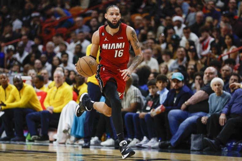 Dec 23, 2022; Miami, Florida, USA; Miami Heat forward Caleb Martin (16) dribbles the basketball during the second quarter against the Indiana Pacers at FTX Arena. Mandatory Credit: Sam Navarro-USA TODAY Sports