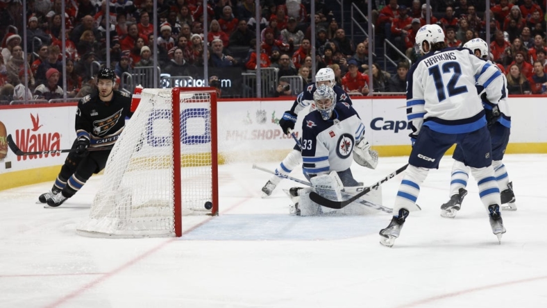 Dec 23, 2022; Washington, District of Columbia, USA; Winnipeg Jets goaltender David Rittich (33) is beaten by a shot by Washington Capitals center Nic Dowd (not pictured) in the third period at Capital One Arena. Mandatory Credit: Geoff Burke-USA TODAY Sports
