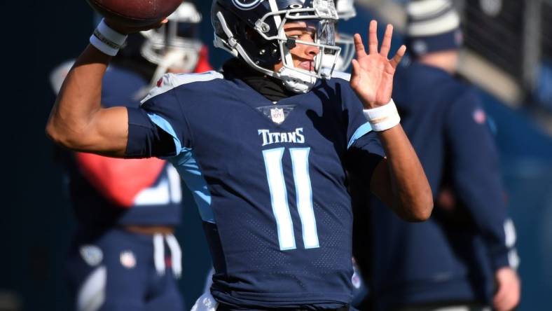 Dec 24, 2022; Nashville, Tennessee, USA; Tennessee Titans quarterback Joshua Dobbs (11) warms up before the game against the Houston Texans at Nissan Stadium. Mandatory Credit: Christopher Hanewinckel-USA TODAY Sports