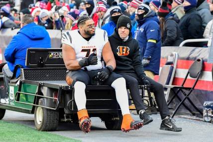 Dec 24, 2022; Foxborough, Massachusetts, USA; Cincinnati Bengals offensive tackle La'el Collins (71) leaves the field on a cart during the first half against the New England Patriots at Gillette Stadium. Mandatory Credit: Eric Canha-USA TODAY Sports