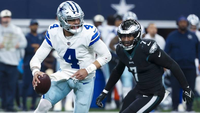 Dec 24, 2022; Arlington, Texas, USA;  Dallas Cowboys quarterback Dak Prescott (4) looks to pass as Philadelphia Eagles linebacker Haason Reddick (7) chases during the first quarter at AT&T Stadium. Mandatory Credit: Kevin Jairaj-USA TODAY Sports