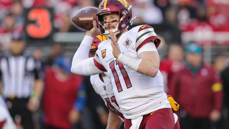 Dec 24, 2022; Santa Clara, California, USA; Washington Commanders quarterback Carson Wentz (11) throws a pass during the fourth quarter against the San Francisco 49ers at Levi's Stadium. Mandatory Credit: Sergio Estrada-USA TODAY Sports