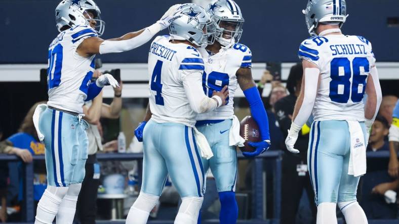 Dec 24, 2022; Arlington, Texas, USA;  Dallas Cowboys wide receiver CeeDee Lamb (88) celebrates with teammates after scoring a touchdown  during the second half against the Philadelphia Eagles at AT&T Stadium. Mandatory Credit: Kevin Jairaj-USA TODAY Sports