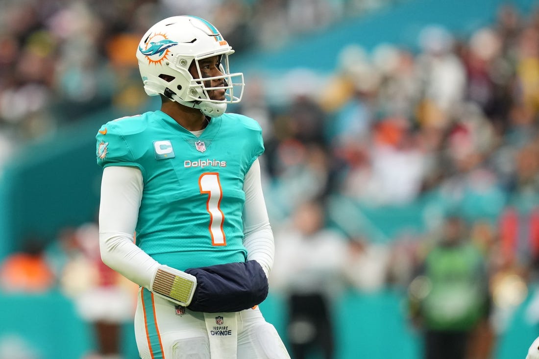 Dec 25, 2022; Miami Gardens, Florida, USA; Miami Dolphins quarterback Tua Tagovailoa (1) stands on the field during the second half against the Green Bay Packers at Hard Rock Stadium. Mandatory Credit: Jasen Vinlove-USA TODAY Sports