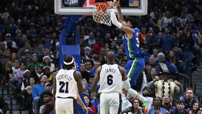 Dec 25, 2022; Dallas, Texas, USA; Dallas Mavericks forward Christian Wood (35) dunks the ball as Los Angeles Lakers guard Patrick Beverley (21) and forward LeBron James (6) look on during the second half at the American Airlines Center. Mandatory Credit: Jerome Miron-USA TODAY Sports