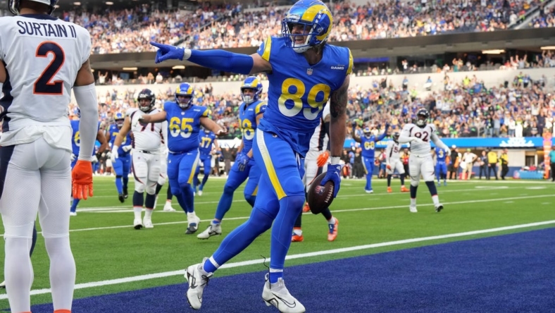 Dec 25, 2022; Inglewood, California, USA; Los Angeles Rams tight end Tyler Higbee (89) celebrates after scoring on a 9-yard touchdown pass against Denver Broncos cornerback Pat Surtain II (2) in the first half at SoFi Stadium. Mandatory Credit: Kirby Lee-USA TODAY Sports