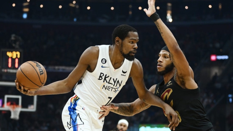 Dec 26, 2022; Cleveland, Ohio, USA; Brooklyn Nets forward Kevin Durant (7) drives to the basket against Cleveland Cavaliers forward Lamar Stevens (8) during the first half at Rocket Mortgage FieldHouse. Mandatory Credit: Ken Blaze-USA TODAY Sports