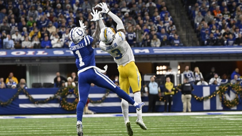 Dec 26, 2022; Indianapolis, Indiana, USA;  Los Angeles Chargers safety Derwin James Jr. (3) intercepts a pass meant for Indianapolis Colts wide receiver Parris Campbell (1) during the first quarter at Lucas Oil Stadium. Mandatory Credit: Marc Lebryk-USA TODAY Sports