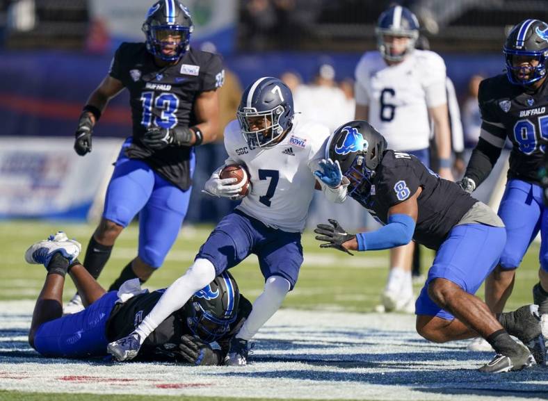 Dec 27, 2022; Montgomery, Alabama, USA; Georgia Southern Eagles wide receiver Khaleb Hood (7) is tackled by Buffalo Bulls defensive end C.J. Bazile (53) and linebacker James Patterson (8) during the first half in the 2022 Camellia Bowl at Cramton Bowl. Mandatory Credit: Marvin Gentry-USA TODAY Sports