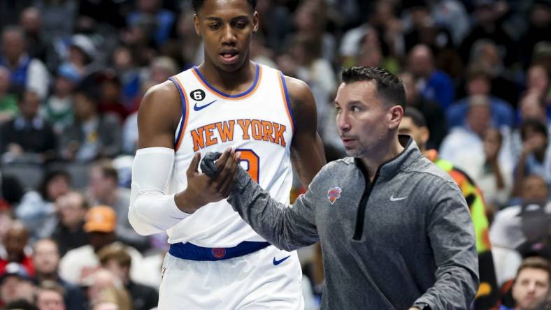 Dec 27, 2022; Dallas, Texas, USA;  New York Knicks guard RJ Barrett (9) leaves the court with an injury during the first quarter against the Dallas Mavericks at American Airlines Center. Mandatory Credit: Kevin Jairaj-USA TODAY Sports