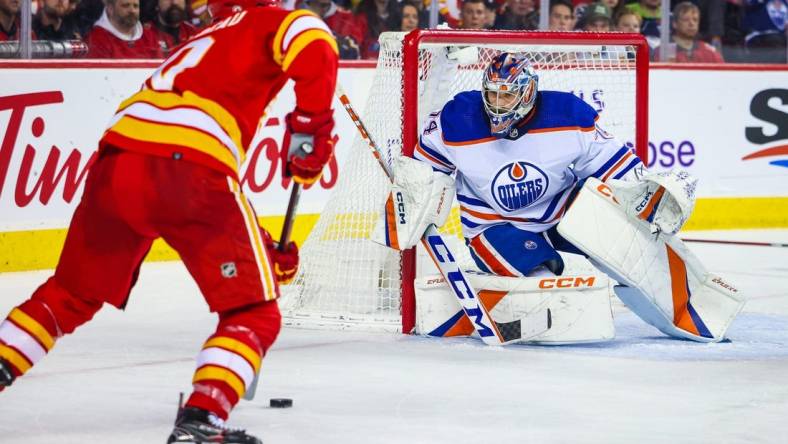 Dec 27, 2022; Calgary, Alberta, CAN; Edmonton Oilers goaltender Stuart Skinner (74) guards his net against the Calgary Flames during the second period at Scotiabank Saddledome. Mandatory Credit: Sergei Belski-USA TODAY Sports