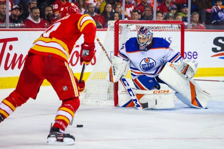 Dec 27, 2022; Calgary, Alberta, CAN; Edmonton Oilers goaltender Stuart Skinner (74) guards his net against the Calgary Flames during the second period at Scotiabank Saddledome. Mandatory Credit: Sergei Belski-USA TODAY Sports