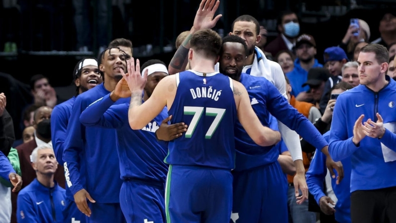 Dec 27, 2022; Dallas, Texas, USA;  Dallas Mavericks guard Luka Doncic (77) celebrates with teammates after leaving the game in overtime against the New York Knicks at American Airlines Center. Mandatory Credit: Kevin Jairaj-USA TODAY Sports