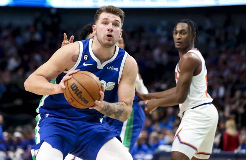 Dec 27, 2022; Dallas, Texas, USA;  Dallas Mavericks guard Luka Doncic (77) looks to pass during the second half against the New York Knicks at American Airlines Center. Mandatory Credit: Kevin Jairaj-USA TODAY Sports