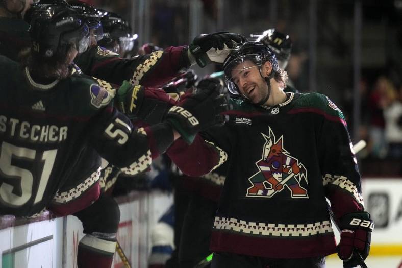 Dec 27, 2022; Tempe, Arizona, USA; Arizona Coyotes left wing Michael Carcone (53) celebrates a goal against the Colorado Avalanche during the third period at Mullett Arena. Mandatory Credit: Joe Camporeale-USA TODAY Sports