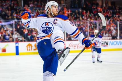 Dec 27, 2022; Calgary, Alberta, CAN; Edmonton Oilers center Connor McDavid (97) celebrates his goal against the Calgary Flames during the third period at Scotiabank Saddledome. Mandatory Credit: Sergei Belski-USA TODAY Sports