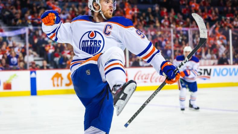 Dec 27, 2022; Calgary, Alberta, CAN; Edmonton Oilers center Connor McDavid (97) celebrates his goal against the Calgary Flames during the third period at Scotiabank Saddledome. Mandatory Credit: Sergei Belski-USA TODAY Sports