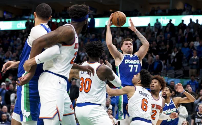 Dec 27, 2022; Dallas, Texas, USA;  Dallas Mavericks guard Luka Doncic (77) scores near the end of the fourth quarter against the New York Knicks at American Airlines Center. Mandatory Credit: Kevin Jairaj-USA TODAY Sports