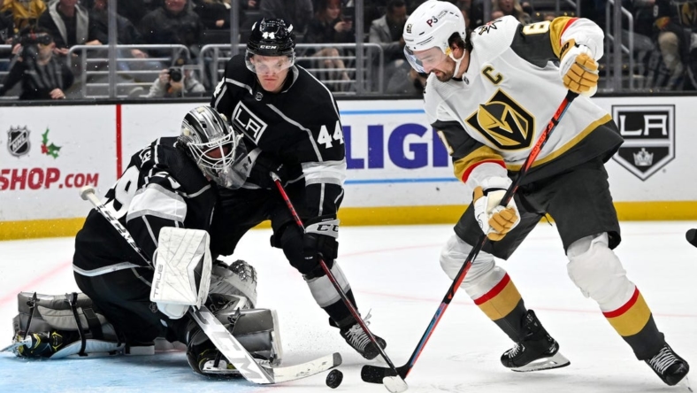 Dec 27, 2022; Los Angeles, California, USA; Los Angeles Kings goaltender Pheonix Copley (29) and defenseman Mikey Anderson (44) defend a shot on goal by Vegas Golden Knights right wing Mark Stone (61) in the third period at Crypto.com Arena. Mandatory Credit: Jayne Kamin-Oncea-USA TODAY Sports