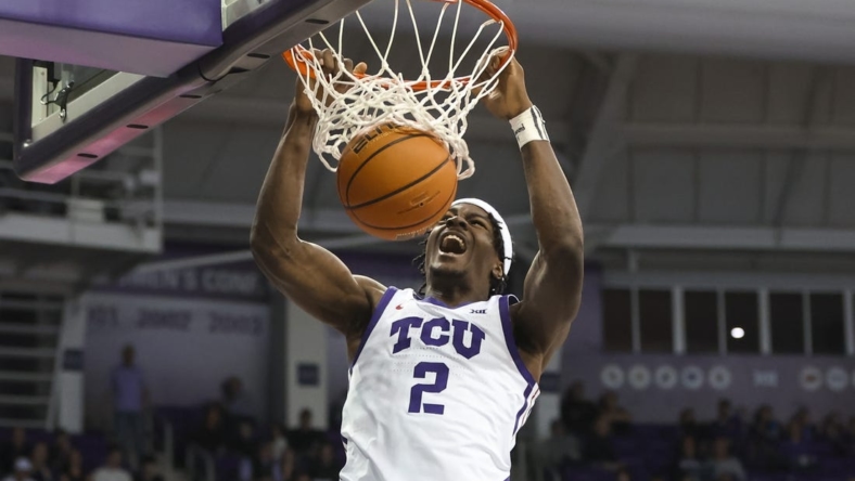 Dec 28, 2022; Fort Worth, Texas, USA;  TCU Horned Frogs forward Emanuel Miller (2) dunks during the second half against the Central Arkansas Bears at Ed and Rae Schollmaier Arena. Mandatory Credit: Kevin Jairaj-USA TODAY Sports