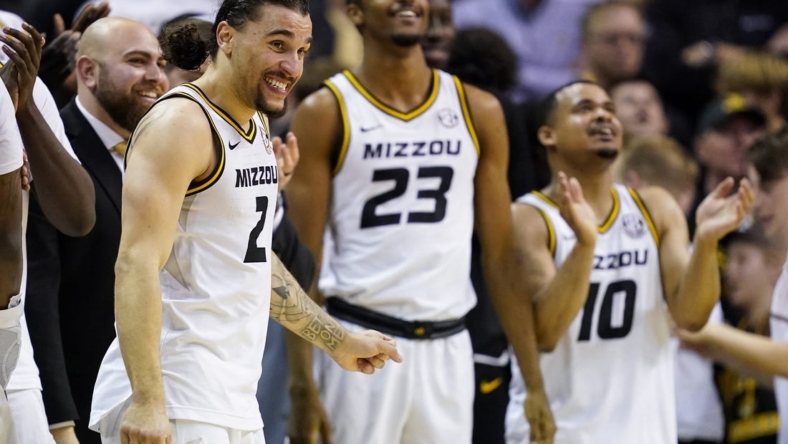 Dec 28, 2022; Columbia, Missouri, USA; Missouri Tigers guard Tre Gomillion (2) and forward Aidan Shaw (23) and guard Nick Honor (10) celebrate late in the second half against the Kentucky Wildcats at Mizzou Arena. Mandatory Credit: Jay Biggerstaff-USA TODAY Sports