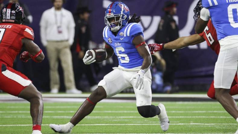 Dec 28, 2022; Houston, Texas, USA; Mississippi Rebels running back Zach Evans (6) runs with the ball during the second quarter against the Texas Tech Red Raiders in the 2022 Texas Bowl at NRG Stadium. Mandatory Credit: Troy Taormina-USA TODAY Sports