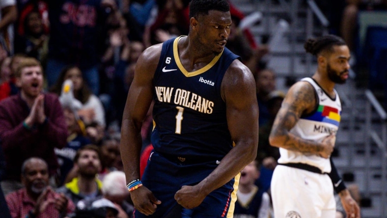 Dec 28, 2022; New Orleans, Louisiana, USA; New Orleans Pelicans forward Zion Williamson (1) reacts to making a basket against Minnesota Timberwolves guard D'Angelo Russell (0) during the second half at Smoothie King Center. Mandatory Credit: Stephen Lew-USA TODAY Sports